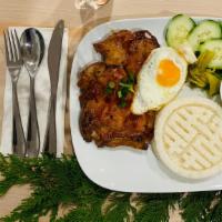 Cơm Tấm  Sườn Opla · SaiGon pork steak on broken rice, sunnyside egg, cucumbers, house pickles, and lime chilli f...