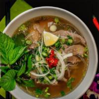 Pho Tai Chin · Rare steak and well-done brisket noodle soup served with bean sprouts, basil, jalepeno, chil...