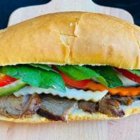 Bbq Pork Banh Mi · Includes, house pickles, spread, cucumber, jalapenos and cilantro/basil