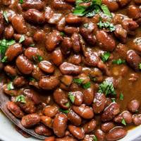 Black Beans Or Pinto Beans · Choose from you choice of black bean or pinto beans seasoned and slow cooked.