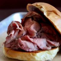 Roast Beef Sandwich · Our famous roast beef sliced thin and piled high, served on a white bun.