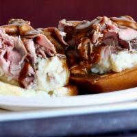 Open Face Roast Beef · Our famous roast beef, thinly sliced. Served with mashed potatoes, gravy and a white bun.