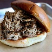 Pulled Pork Sandwich · Our slow roasted pulled pork, pulled high on a white bun.