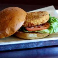 Crispy Chicken Sandwich · Breaded and fried, crispy chicken breast. Served with lettuce & tomato on a toasted white bun.