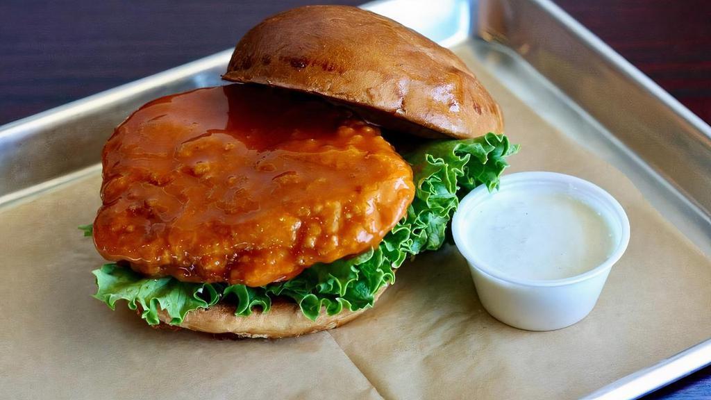Buffalo Chicken Sandwich · Breaded and fried, crispy chicken breast, tossed in our house made buffalo sauce and served with lettuce tomato and our famous ranch dressing.