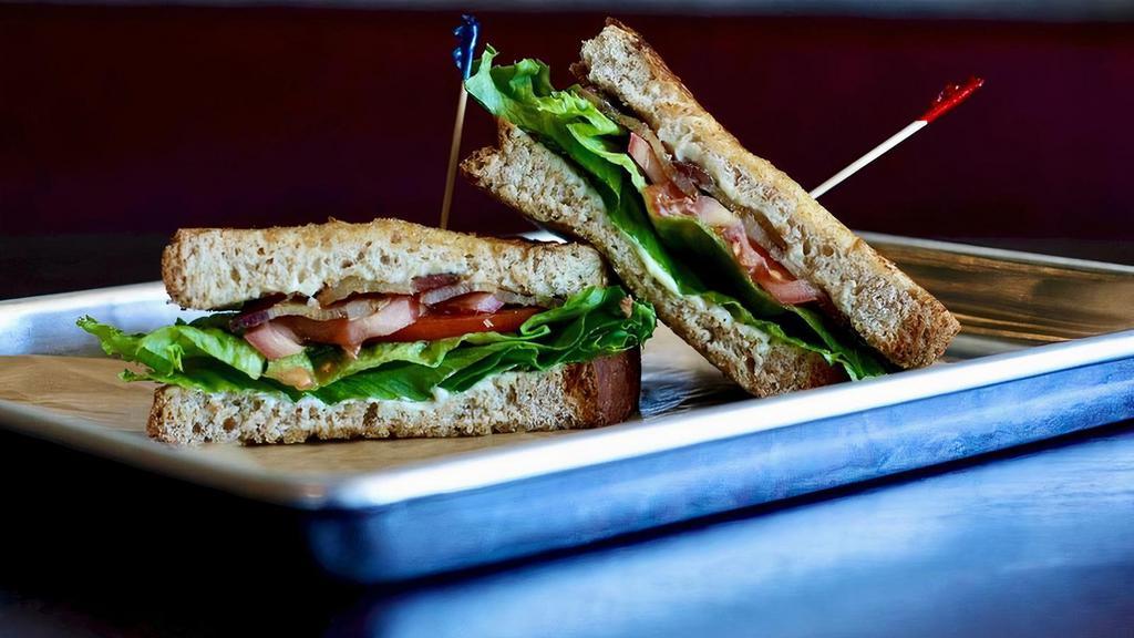 Blt · Bacon, Lettuce, Tomato and Mayo served on whole grain wheat bread.