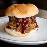 Pulled Pork Sandwich · Our famous smoked pork piled high on a bun.