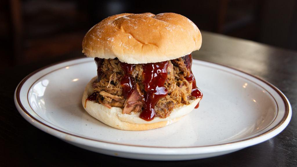 Pulled Pork Sandwich · Our famous smoked pork piled high on a bun.