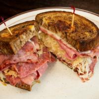 Classic Reuben · Lean corned beef with sauerkraut or sliced smoked turkey with coleslaw, 1000 Island, melted ...