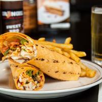 Spicy Buffalo Chicken Wrap · Crunchy breaded chicken breast, spicy buffalo sauce, crisp shredded lettuce and thinly slice...