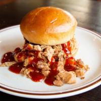 Pulled Bbq Chicken · Slow cooked whole chicken, hand pulled and piled high with our homemade dry rub on a bun.