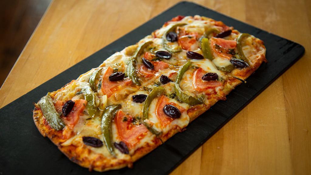 Vegetarian Flatbread · Green peppers, onions, mushrooms and black olives atop Mozzarella cheese.
