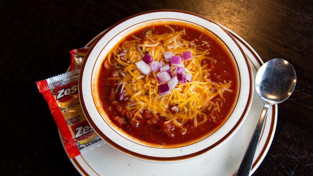 Beef Brisket Chili · Smoked brisket chili with our special blend of beans and Southern-style spices topped with cheese and onions.