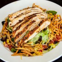 Southwest Chicken Salad · Large house salad tossed with black beans, corn, shredded cheese, and salsa, with chipotle r...