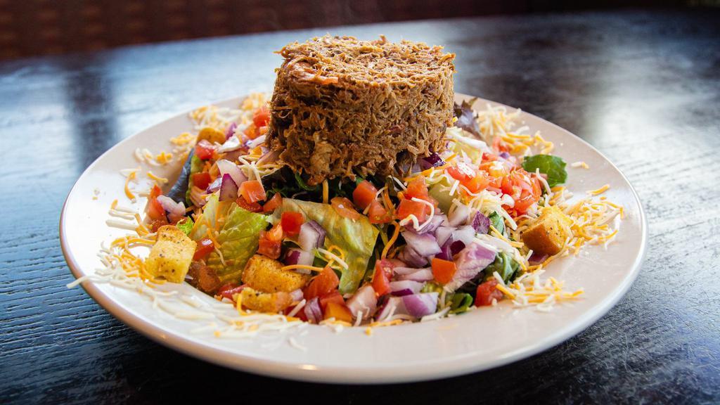 Bbq Salad · Mixed greens with tomatoes, shredded cheese and onions topped with Iron Grill's slow-smoked, full flavor pulled pork, or pulled chicken, with seasoned croutons and your choice of dressing.