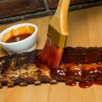 Baby Back Ribs (Half Rack) · Tender baby back ribs slow roasted to perfection. Glazed with our sweet Kansas city BBQ sauc...