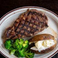 Ribeye Steak Dinner · A 16 ounce cut ribeye steak seasoned and perfectly grilled, with fries and a small salad.

C...
