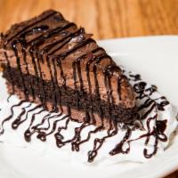Chocolate Cake · Chocolate cake with chocolate frosting and a drizzle of chocolate syrup.