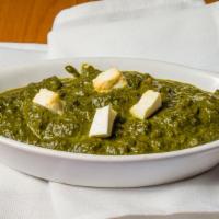 Palak Paneer · Garden fresh spinach and chunks of homemade cheese in a flavorful curry sauce.