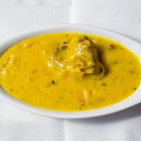 Curry Pakora · Vegetable balls prepared in a special yogurt sauce.