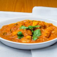 Chicken Tikka Masala · Boneless tandoori chicken cooked in house special masala with sliced onions, tomatoes, ginge...