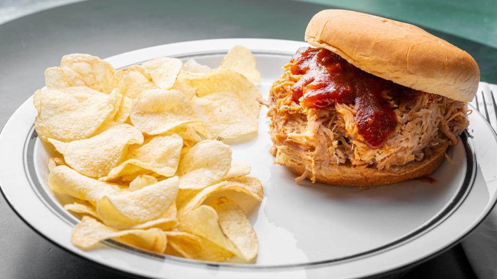Pork Sandwich · Approximately 1/3 lbs of pulled pork.Comes with Chips and Slaw.