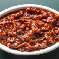 Spicy Baked Beans · Spicy baked beans mixed with shredded pork.