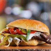 Somali Steak Sandwich · Thin-sliced beef sautéed with African spices, Swiss cheese, tomatoes, lettuce, onions and ma...
