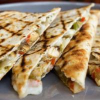 Chicken Quesadilla · Cut of grilled chicken breast with sautéed bell pepper, mozzarella cheese, and sour cream in...