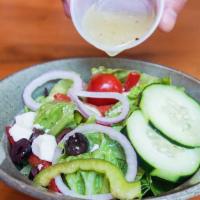 Side Salad · Iceberg tomato, onion, green pepper and cucumber.