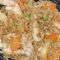 Fried Rice · Sautéed meat with steamed rice, egg, onion, green pea and carrots.