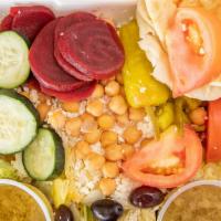 Leo'S Famous Greek Salad (Small) · Made with lettuce, tomato, cucumber slices, pepperoncini, Greek olives, beets, chickpeas, fe...