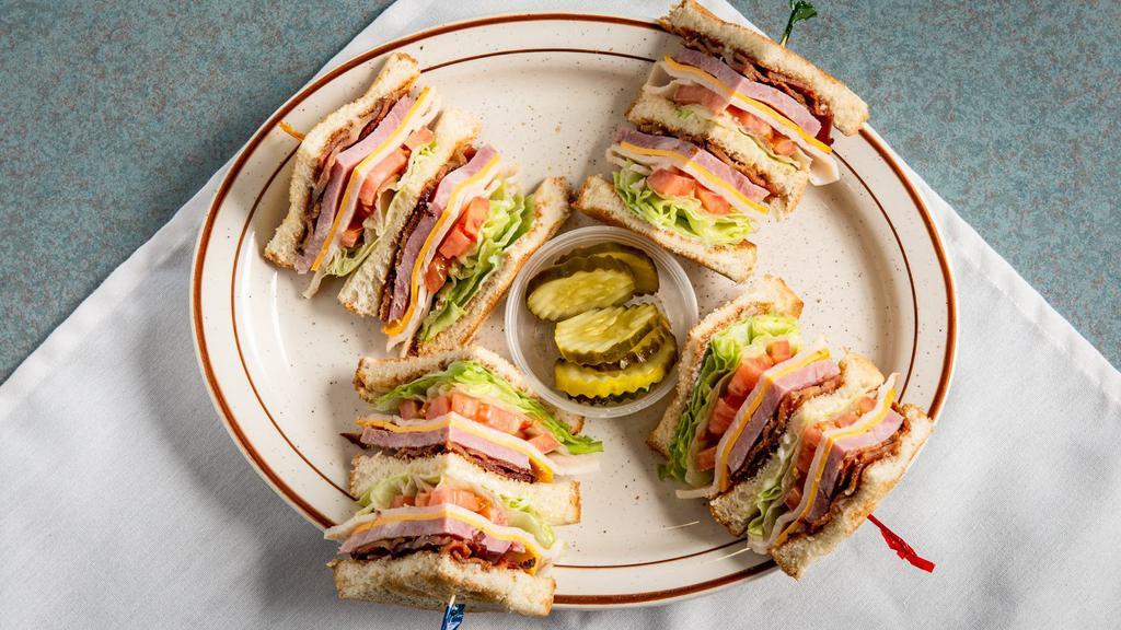 Super Club Sandwich · Triple decker on White or wheat toast with ham, bacon, turkey, lettuce, tomato and American cheese with mayo.