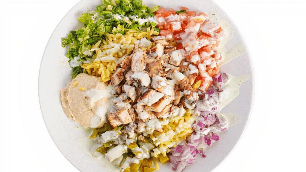 Chicken Shawarma Bowl · Grilled marinated chicken breast, Hummus, Lettuce, tomato, onions pickle, and our special dillio sauce over a bed of yellow rice.