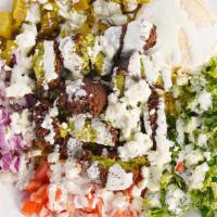 Falafel Bowl (Vegetarian) · Golden Falafel, hummus, lettuce, tomato, onion, pickles, feta cheese, and our special dillio...