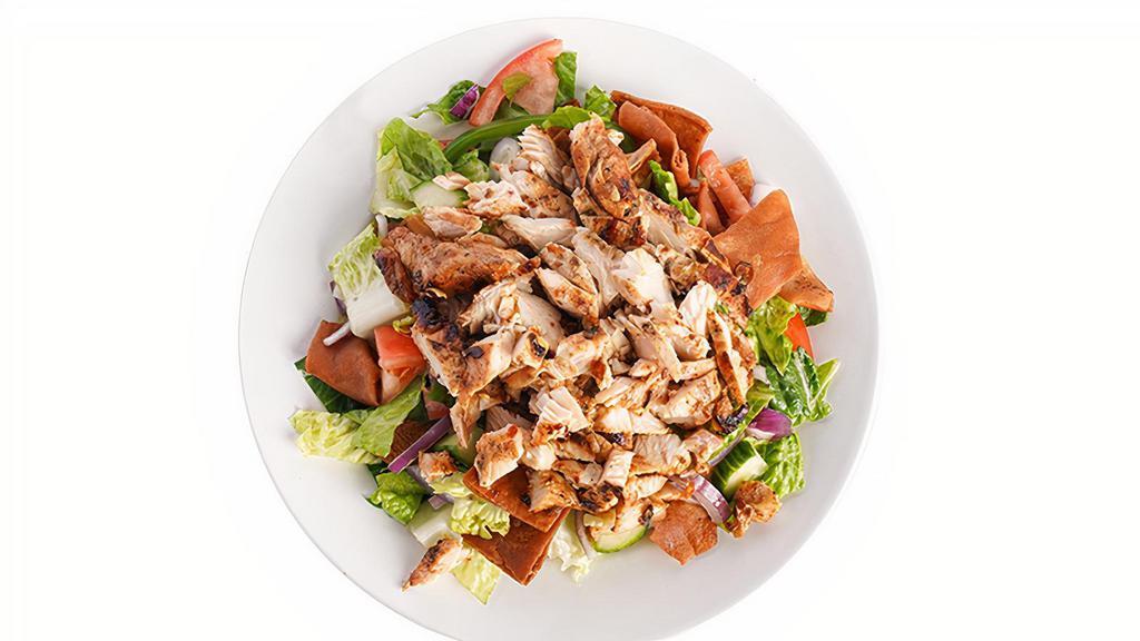 Chicken Shawarma Salad · Grilled marinated chicken breast, Romaine Lettuce, tomato, onions, cucumbers, bell peppers and pita chips Served with our house vinaigrette dressing.