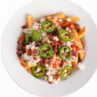 Loaded Shawarma Fries · Our golden french fries topped with marinated grilled chicken, crumbled bacon, feta cheese, ...