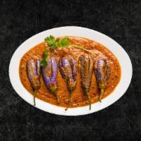 Smoked Eggplant Masala (Vegan) · Spit fire-roasted eggplant slow-cooked with ginger, garlic, onions, green chilis, and finish...