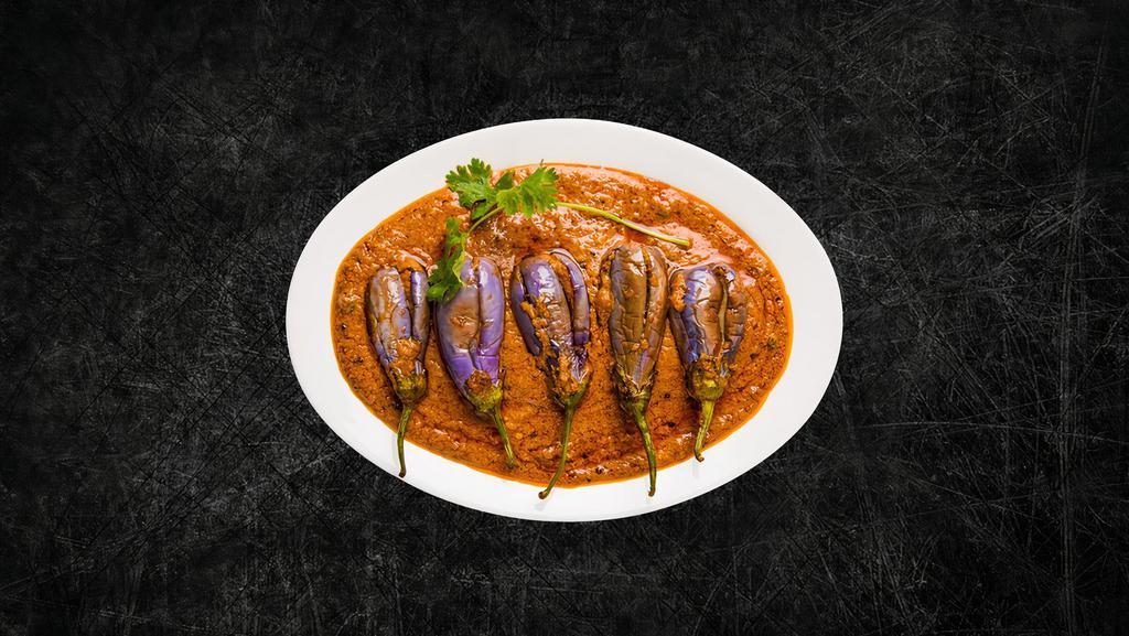 Smoked Eggplant Masala (Vegan) · Spit fire-roasted eggplant slow-cooked with ginger, garlic, onions, green chilis, and finished with coriander.