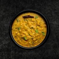Daal Yellow Mellow (Vegan) · Yellow lentils, slow-cooked to perfection and tempered with cumin, garlic, and chilies.