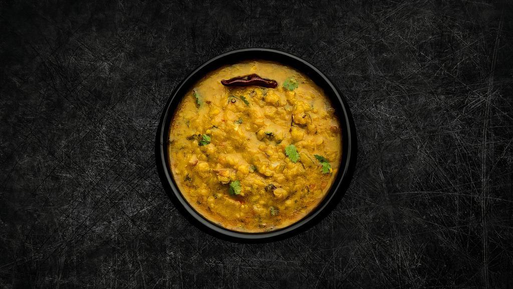 Daal Yellow Mellow (Vegan) · Yellow lentils, slow-cooked to perfection and tempered with cumin, garlic, and chilies.