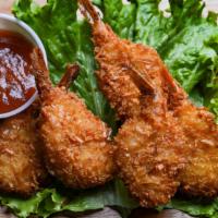Coconut Shrimp · Seven piece shrimp dipped in coconut batter and deep fried golden brown. Served with cocktai...