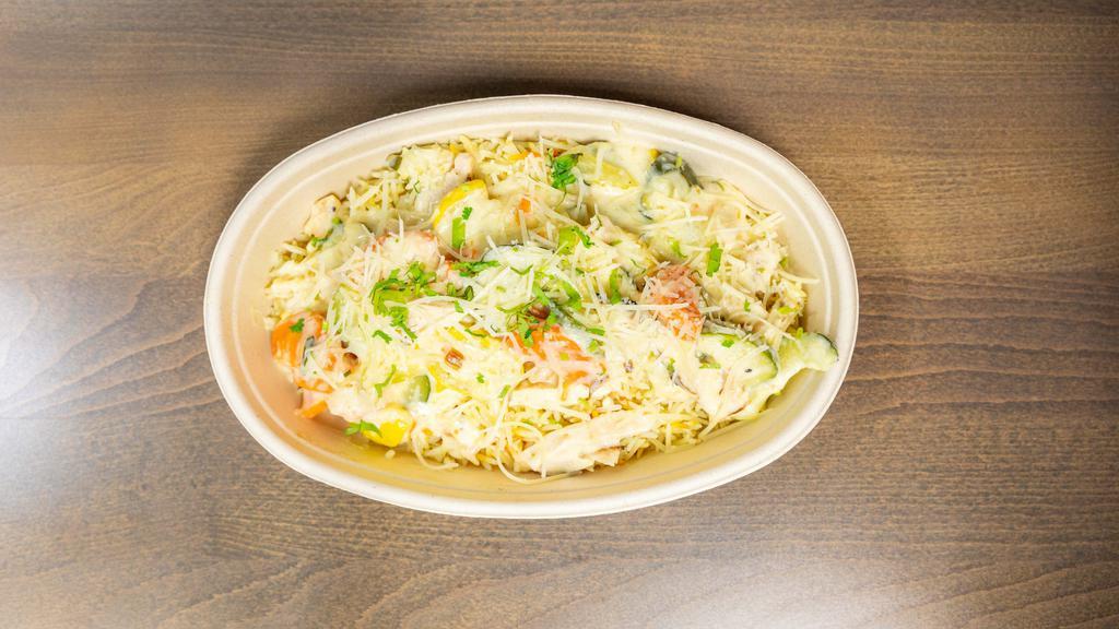 Chicken Fantastic · Cuts of white grilled chicken with sautéed bell peppers, carrots, zucchini, fresh garlic, light cream sauce, and grated parmesan cheese, over somali-seasoned basmati rice