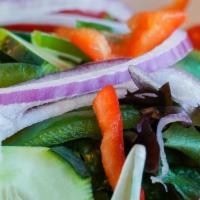 Afrogreen House Salad · Romaine and iceberg lettuce with carrots, bell peppers, onion, tomato, and our homemade lemo...