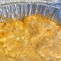 Buffalo Chicken Dip · A mixture of cream cheese, Colby Jack, onion, chicken, and buffalo sauce. Served bubbly with...