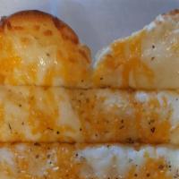 Cheesy Garlic Bread · Freshly baked bread brushed with garlic butter topped with smoked Provolone and Colby and Ja...