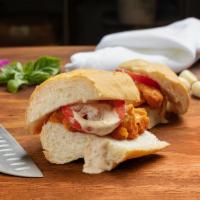 Buffalo Chicken Sliders · Breaded chicken tossed in buffalo sauce, topped with Bleu cheese dressing and tomato.