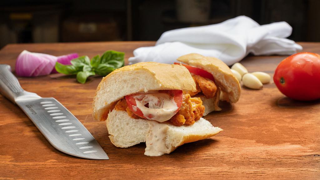 Buffalo Chicken Sliders · Breaded chicken tossed in buffalo sauce, topped with Bleu cheese dressing and tomato.