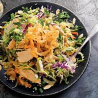 Asian Chicken Salad · Grilled chicken with crunchy noodles, almonds, sesame seeds, green onions, carrots and cilan...