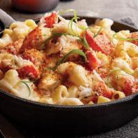 Lobster Mac & Cheese · Shareable size side of white cheddar mac and cheese, with lobster claw meat, panko bread cru...